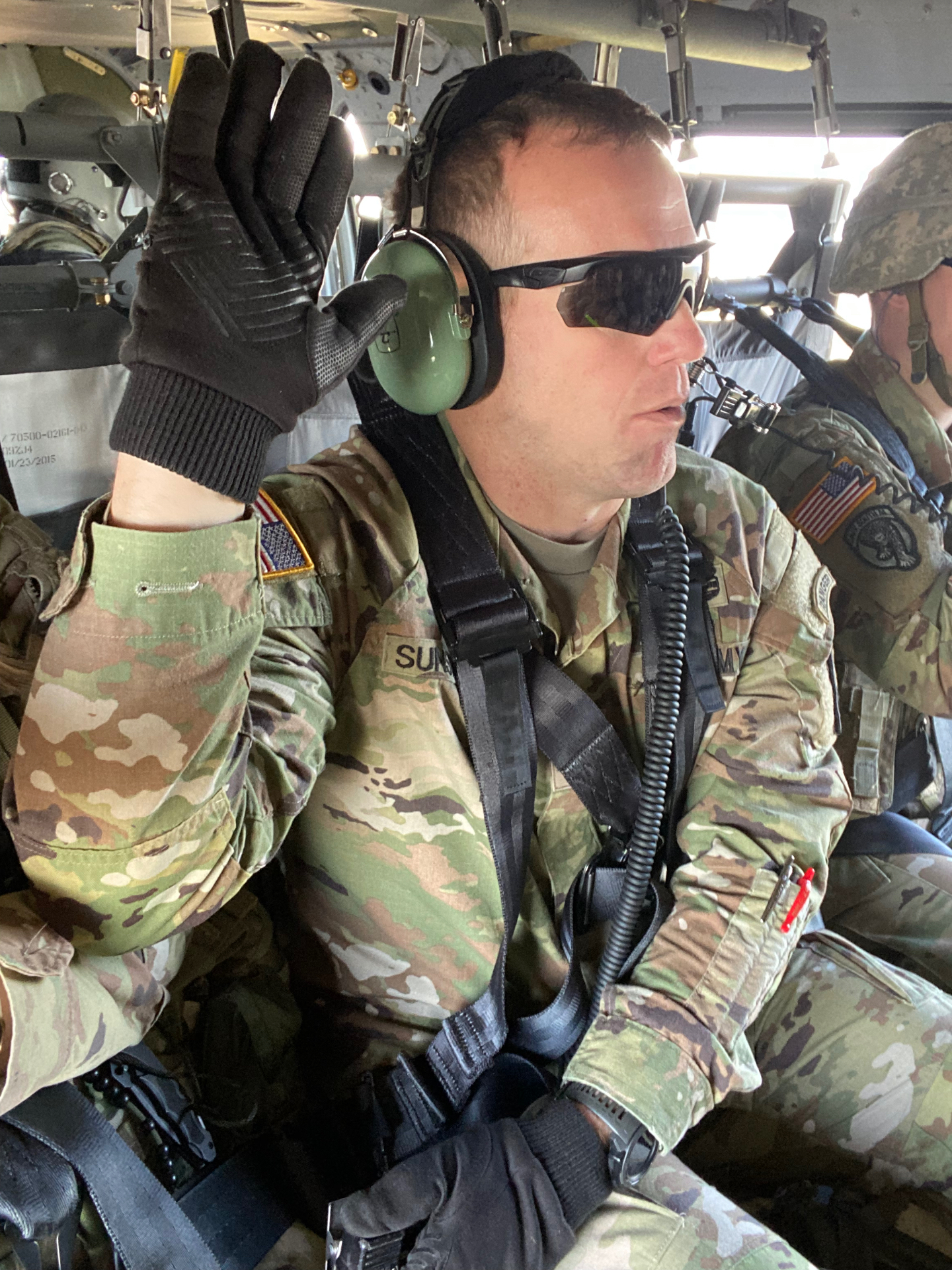Jared Sunsdahl in flight on a military helicopter