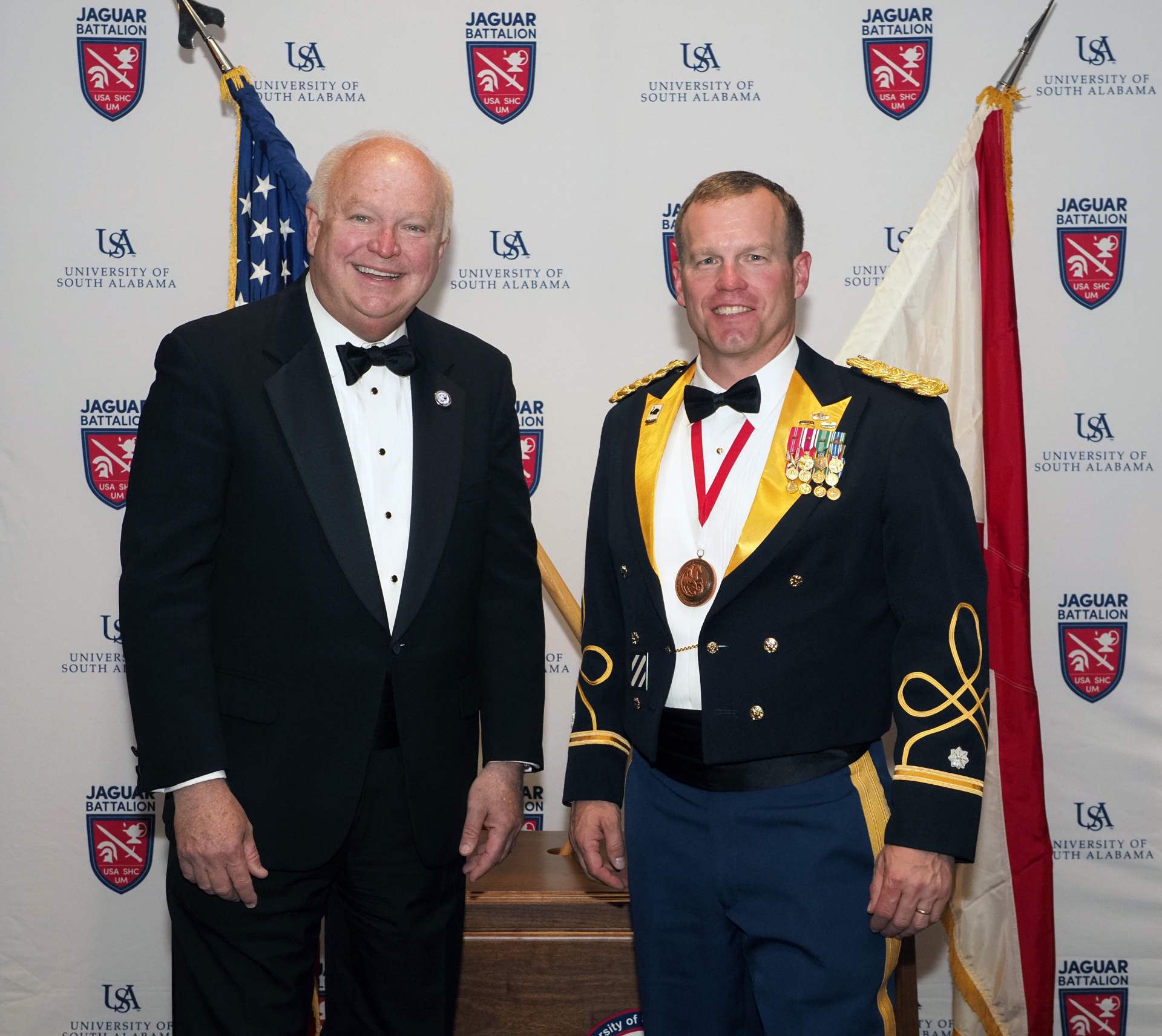 Jared Sunsdahl in Army mess dress uniform receiving recognition
